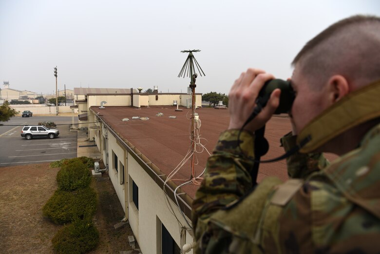 U.S. Air Force Tech. Sgt. David Murphy, 8th Operations Support Squadron mission weather operations noncommissioned officer in charge, checks visibility at Kunsan Air Base, Republic of Korea, March 5, 2019. Visibility, wind speeds and lightning are some of the limiting factors for launching aircraft that the joint USAF-ROKAF weather team predict and track. (U.S. Air Force photo by Staff Sgt. Joshua Edwards)