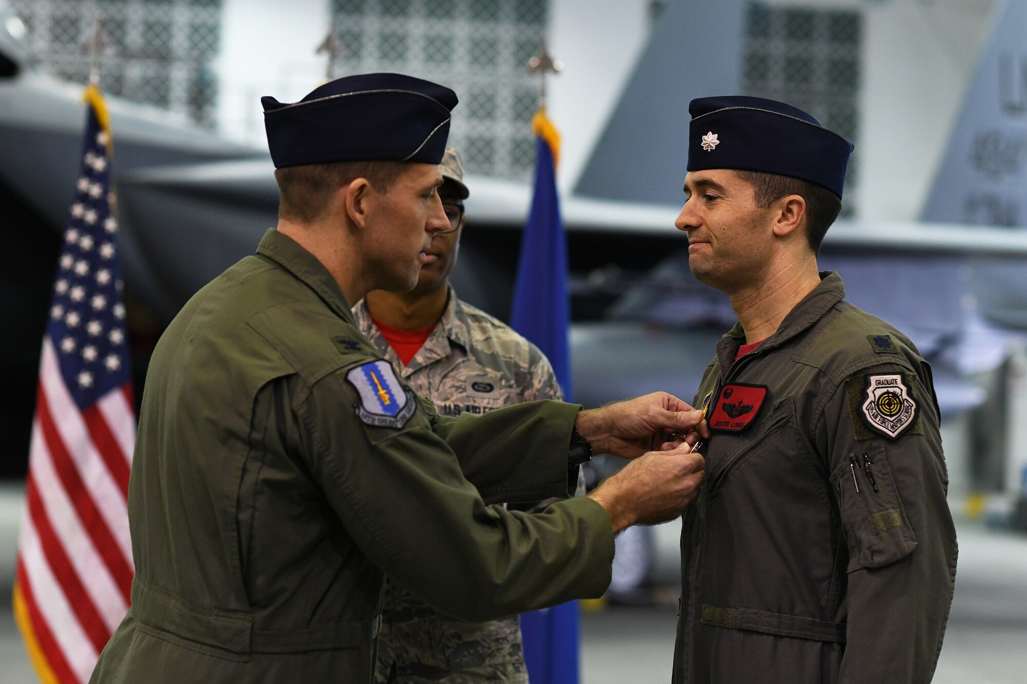 Lt. Col Morgan P. Lohse, outgoing 494th Fighter Squadron commander, receives the Meritorious Service Medal during the 494th FS change of command ceremony at Royal Air Force Lakenheath, England, March 8, 2019. The Meritorious Service Medal is presented to members of the United States Armed Forces who distinguished themselves through outstanding achievement in service of the Unites States of America. (U.S. Air Force photo by Airman 1st Class Shanice Williams-Jones)