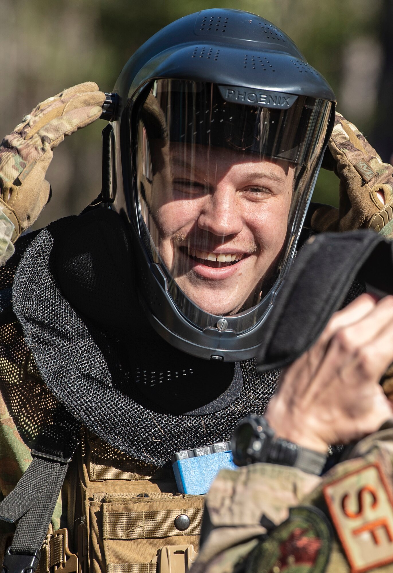 U.S. Air Force Senior Airman Skip Judkins, 20th Security Forces Squadron (SFS) installation entry controller, adjusts his face mask prior to a force-on-force training at Poinsett Electronic Combat Range near Wedgefield, S.C., March 6, 2019.