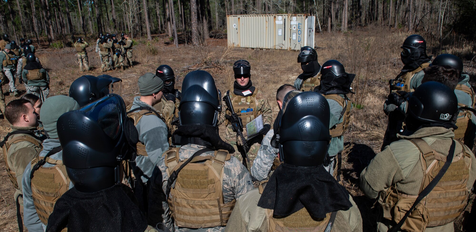 U.S. Air Force Staff Sgt. Jake Lucas, 20th Security Forces Squadron flight chief, center, provides a safety brief during a force-on-force training at Poinsett Electronic Combat Range near Wedgefield, S.C., March 6, 2019.