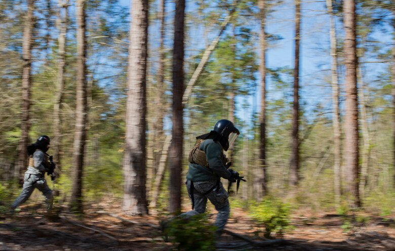 U.S. Airmen assigned to the 20th Security Forces Squadron (SFS) charge toward a simulated threat during a force-on-force training at Poinsett Electronic Combat Range near Wedgefield, S.C., March 6, 2019.