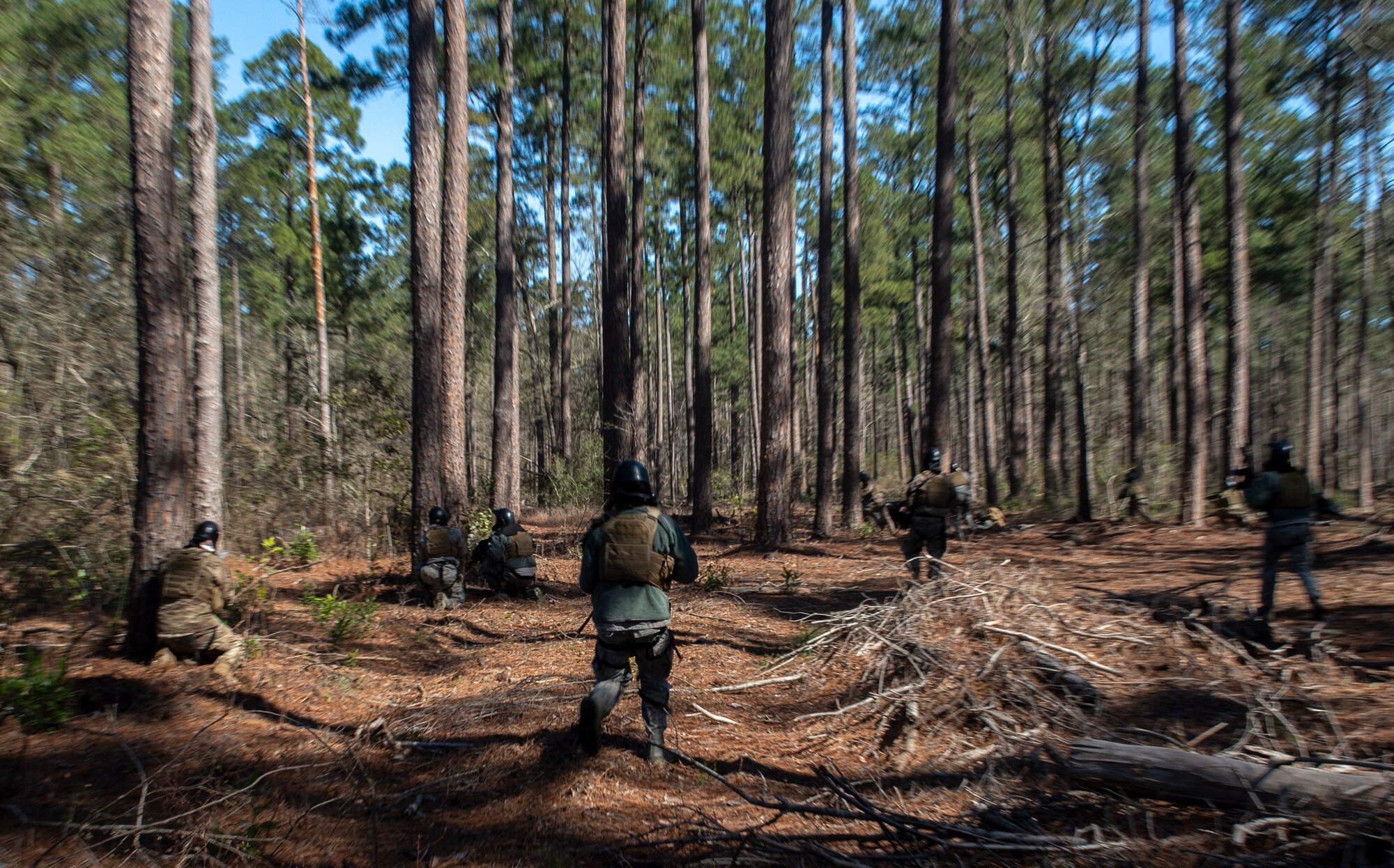 U.S. Airmen assigned to the 20th Security Force Squadron gather around a contact-point during a force-on-force training at Poinsett Electronic Combat Range near Wedgefield, S.C., March 6, 2019.