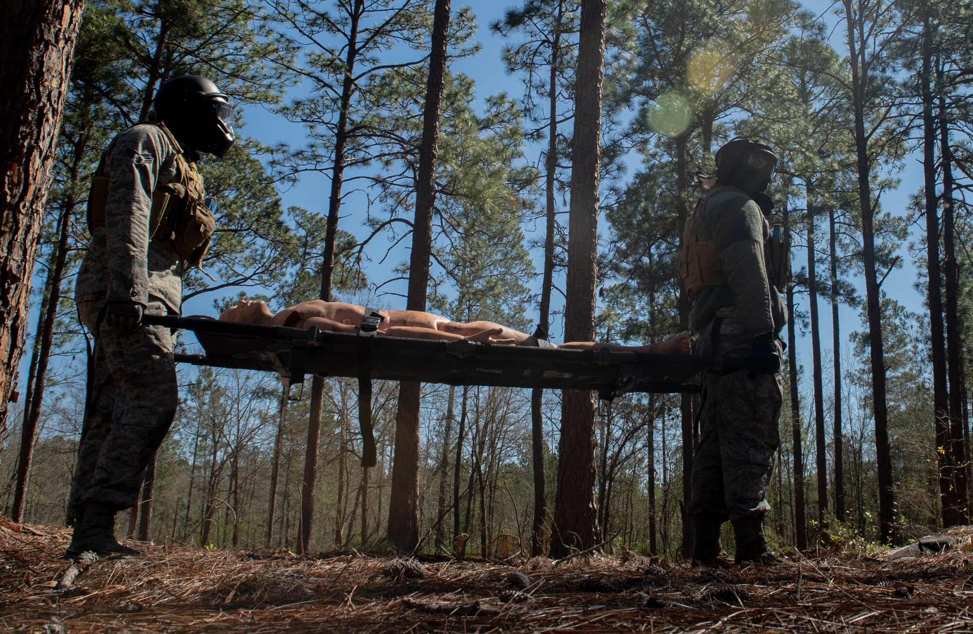 U.S. Airmen assigned to the 20th Security Forces Squadron (SFS) carry a simulated casualty during a force-on-force training at Poinsett Electronic Combat Range near Wedgefield, S.C., March 6, 2019.