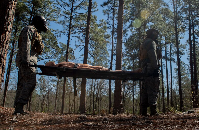 U.S. Airmen assigned to the 20th Security Forces Squadron (SFS) carry a simulated casualty during a force-on-force training at Poinsett Electronic Combat Range near Wedgefield, S.C., March 6, 2019.