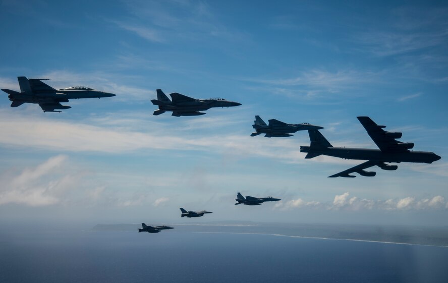 Aircraft from the U.S., Australia and Japan participating in exercise COPE North 2019 engage in a large show-of-force formation