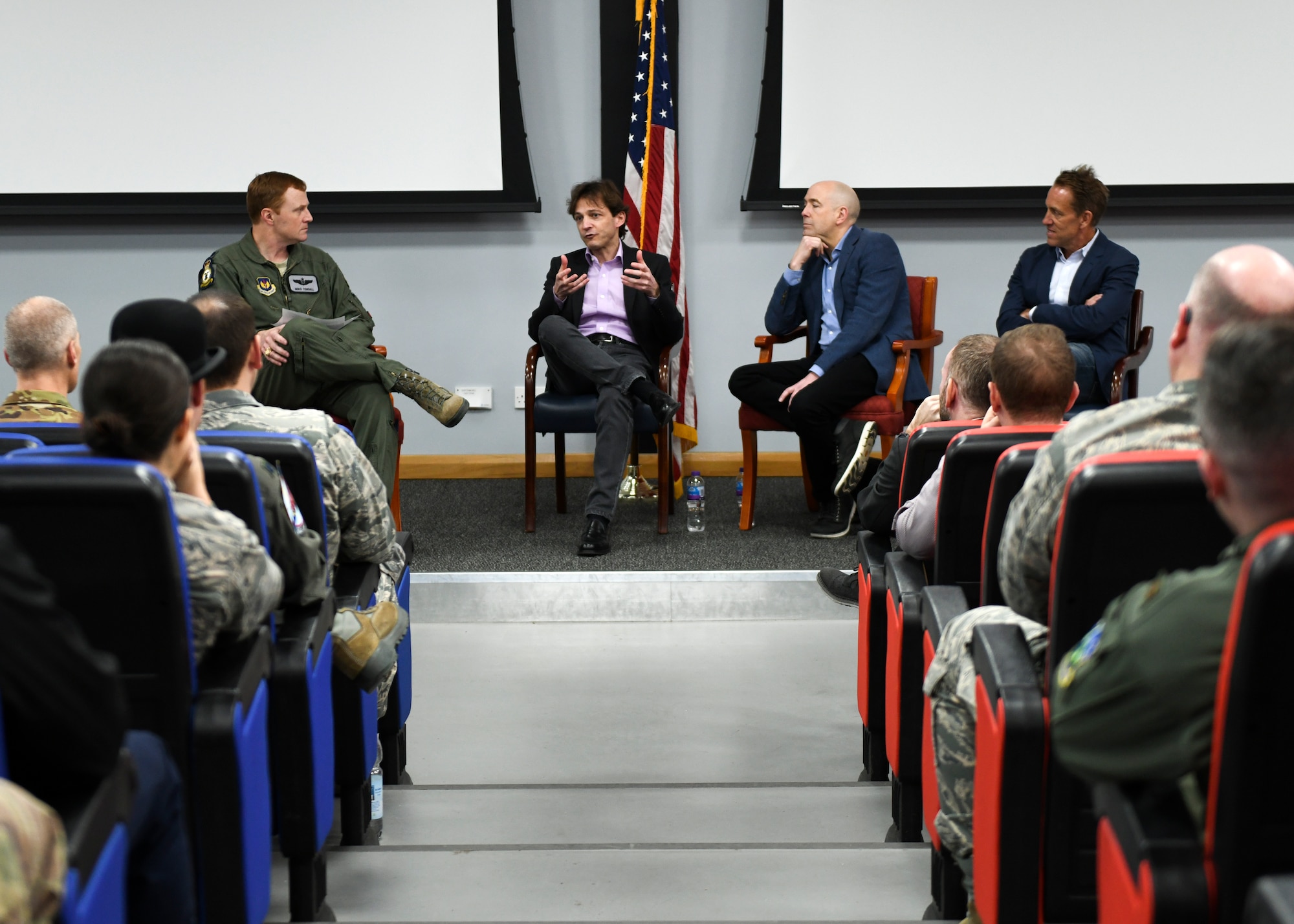 Lt. Col. Timothy Tendall, 48th Fighter Wing chief of flight safety, facilitates a discussion between three business leaders and U.S. Air Force officers during a leadership panel at Royal Air Force Lakenheath, England, in the Strike Eagle Complex auditorium March 1. The event’s topics included how the panelists develop teams, select leaders and solve problems in their companies. (U.S. Air Force photo by Senior Airman Malcolm Mayfield)