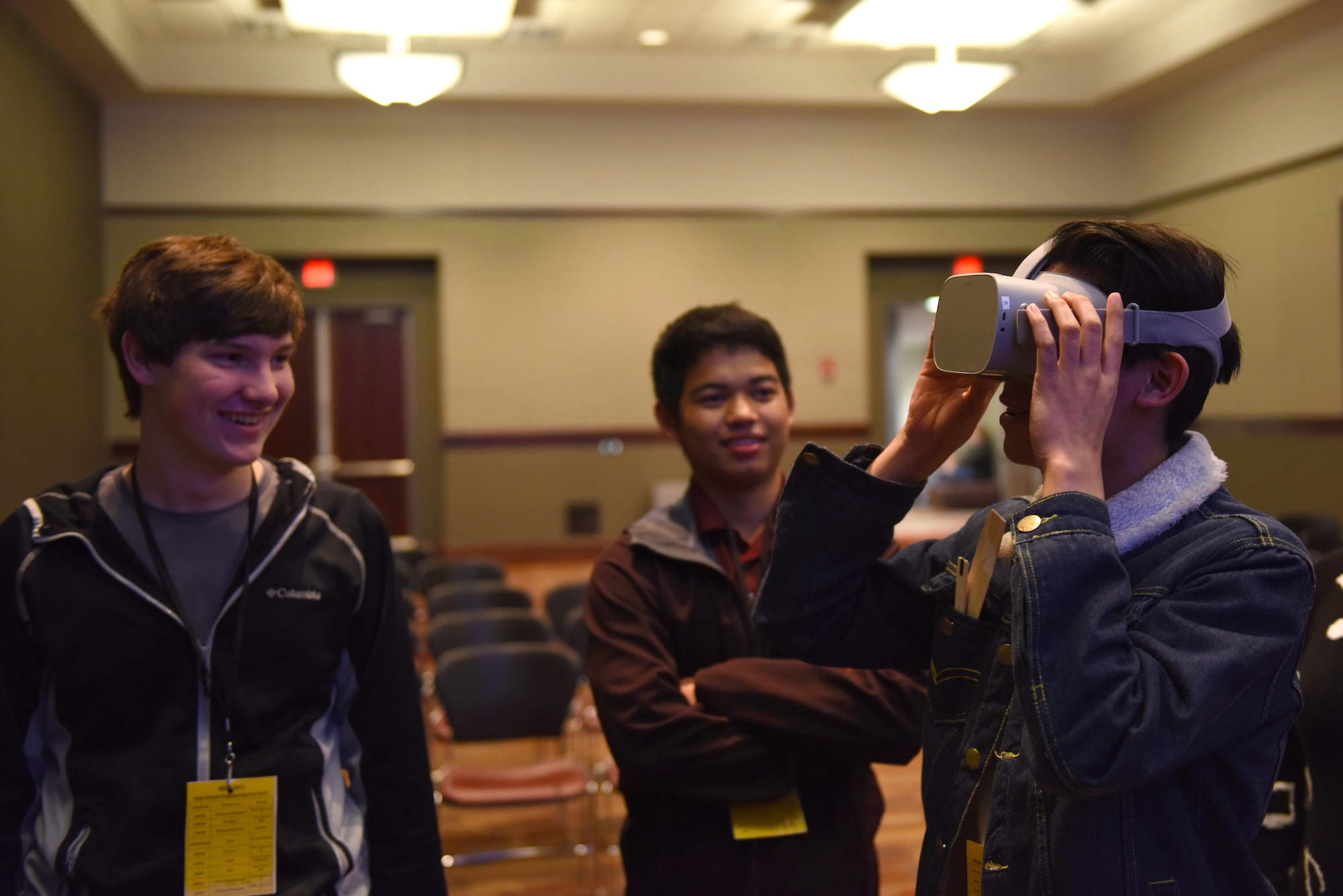 High school students experience the new virtual reality technology the 14th Flying Training Wing is using to revolutionize pilot training at Mississippi State University’s Engineering Day March 4, 2019, in Starkville, Mississippi. Rather than lecture the students about VR technology, the pilots decided that a hands-on experience would leave more of an impression. (U.S. Air Force photo by Senior Airman Beaux Hebert)