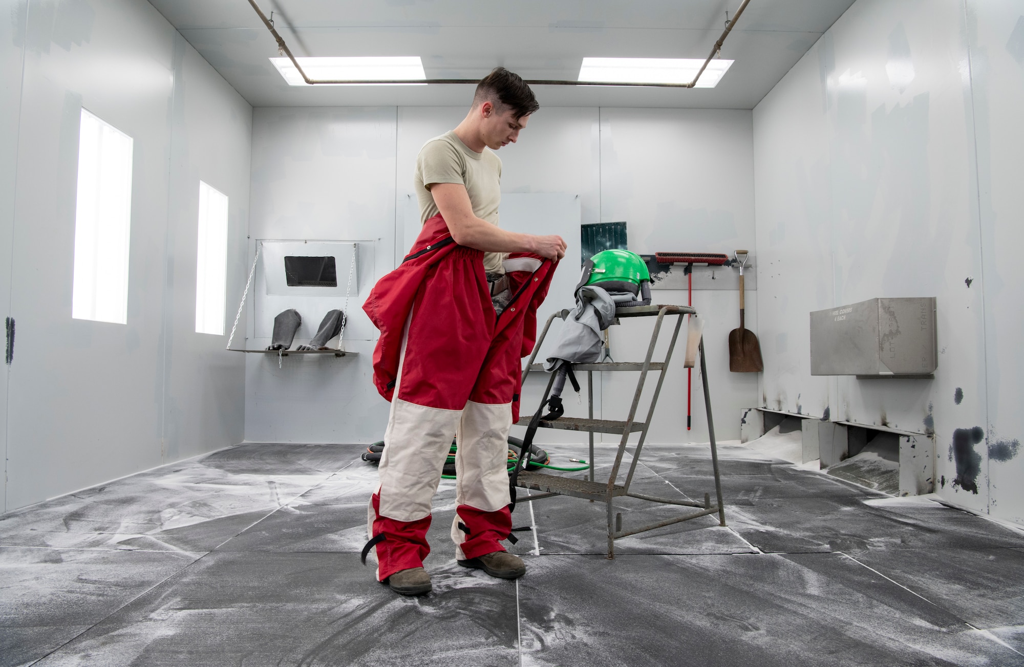 U.S. Air Force Airman 1st Class Evan Green, 33rd Maintenance Squadron Low Observable aircraft structural maintenance journeyman, suits up for media blasting operations Feb. 21, 2019, at Eglin Air Force Base, Fla. The suit provides an operator with a protective barrier against harsh media. (U.S. Air Force photo by Airman 1st Class Daniella Peña-Pavao)