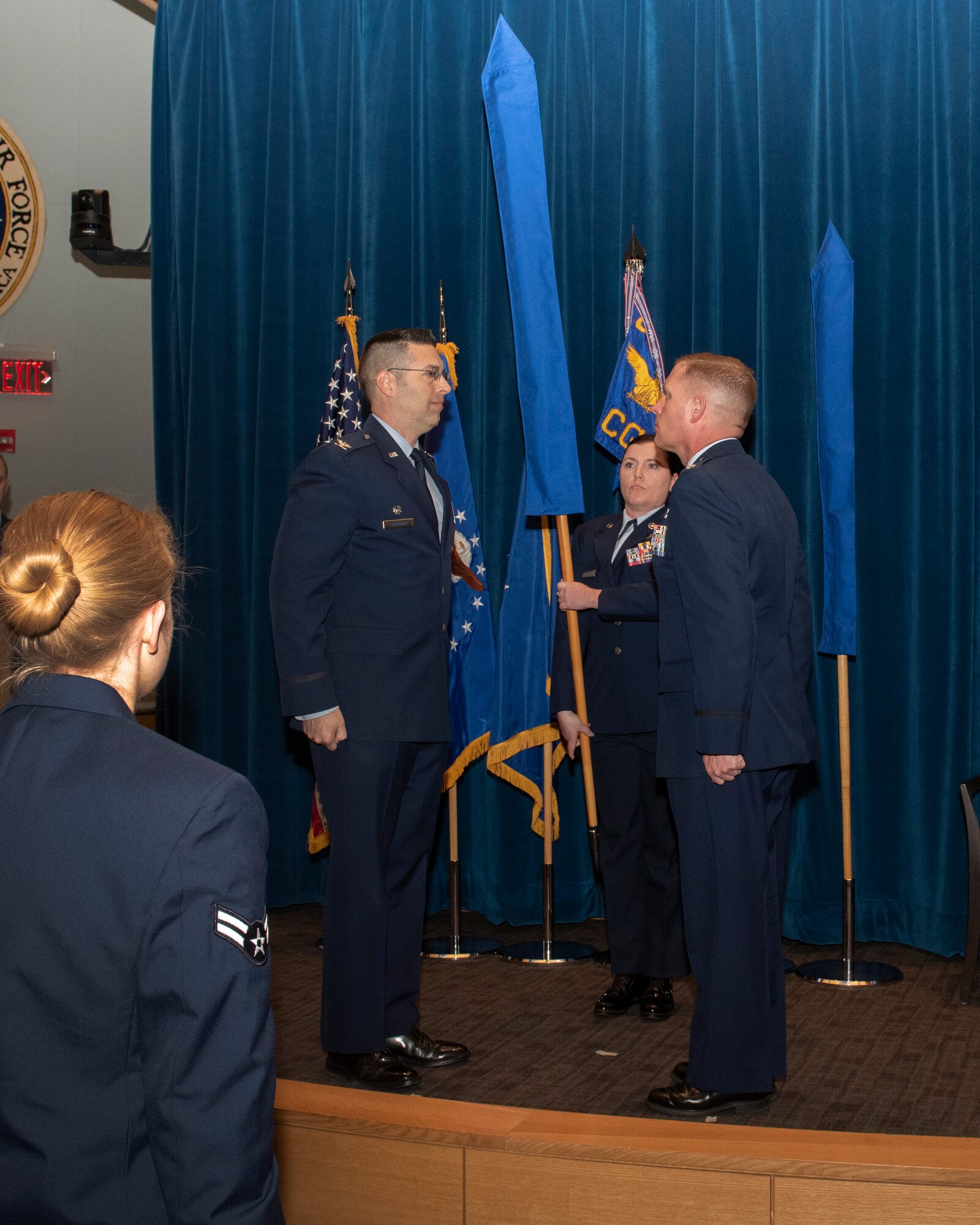 U.S. Air Force Col. Thomas P. Sherman, 88th Air Base Wing commander and Lt. Col. Josef R. Wein, 88th Operations Support Squadron commander, perform realignment ceremony inside the 88th Medical Group auditorium at Wright-Patterson Air Force Base, Ohio, Feb. 27, 2019. The ceremony marks the merge of the 88th OSS with the 88th CG. (U.S. Air Force photo/Michelle Gigante)