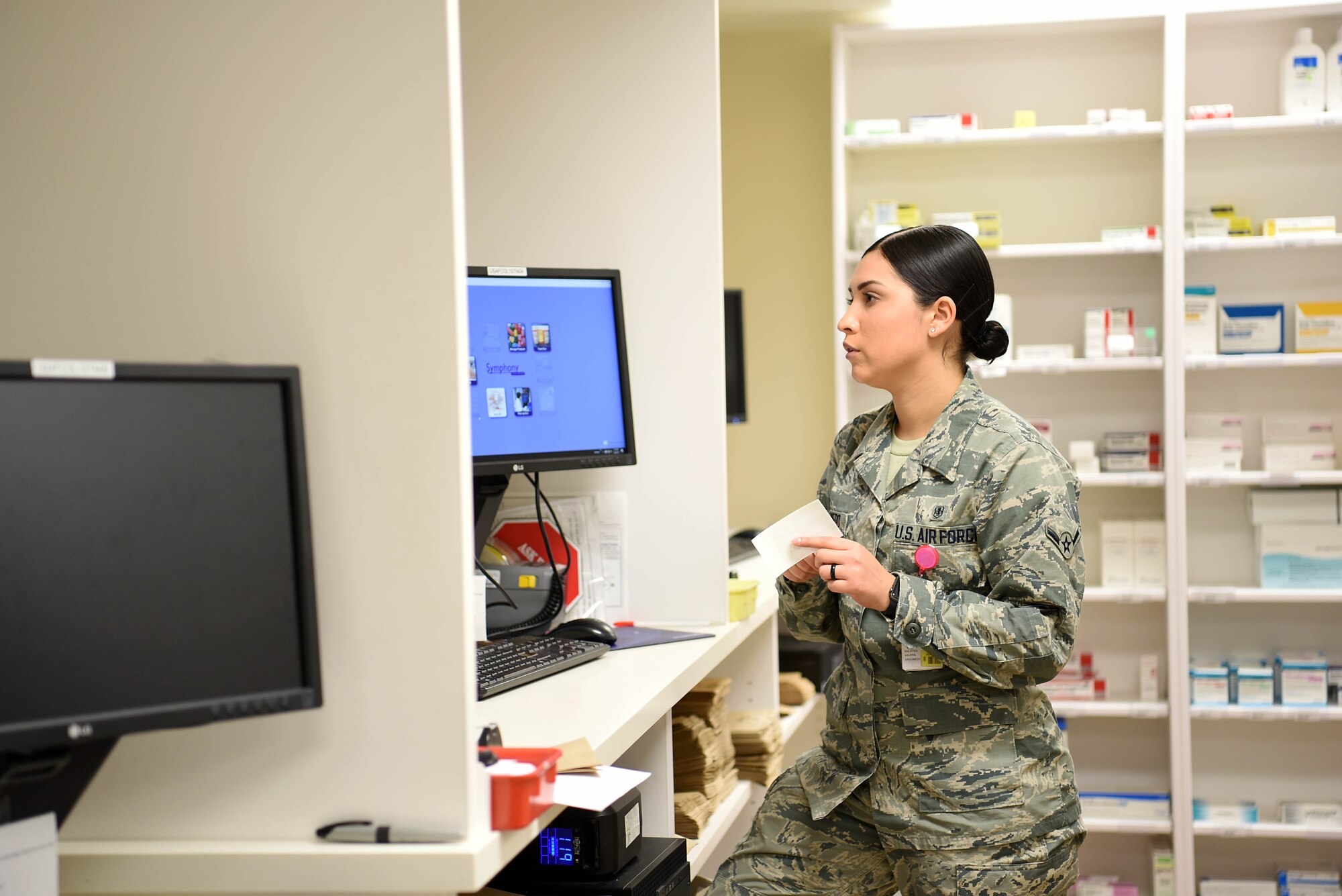 Airman Valerie Argumedo, 14th Medical Support Squadron pharmacy technician, speaks to a customer March 4, 2019, on Columbus Air Force Base, Mississippi. Roughly 1,500 patients are seen weekly by the 14th Medical Support Squadrons pharmacy technicians. (U.S. Air Force photo by Airman 1st Class Keith Holcomb)