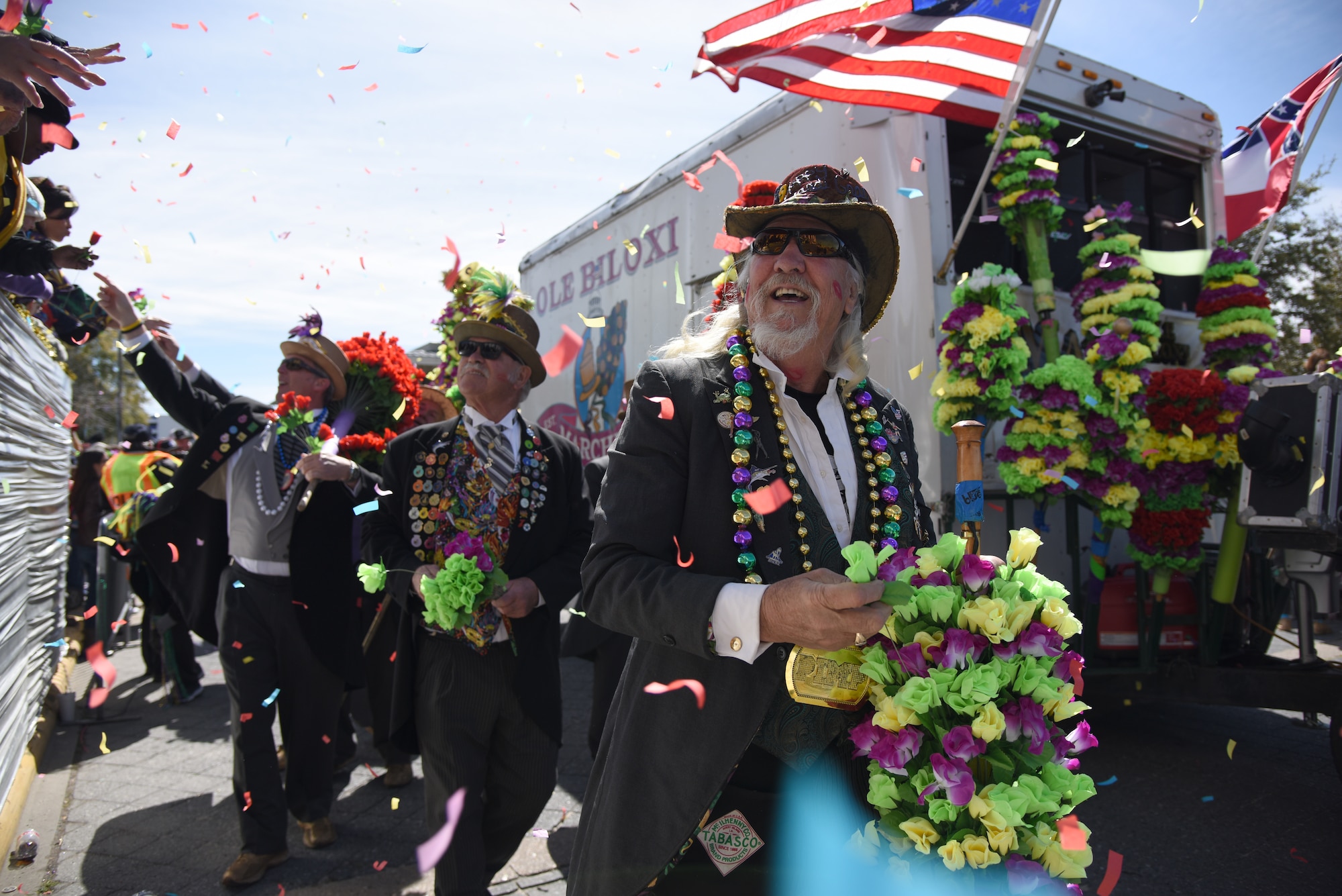 Members of the Ole Biloxi Marching Club participate in the Gulf Coast Carnival Association Mardi Gras parade in Biloxi, Mississippi, March 5, 2019. Keesler personnel participate in local parades every Mardi Gras season to show their support of the communities surrounding the installation. (U.S. Air Force photo by Kemberly Groue)