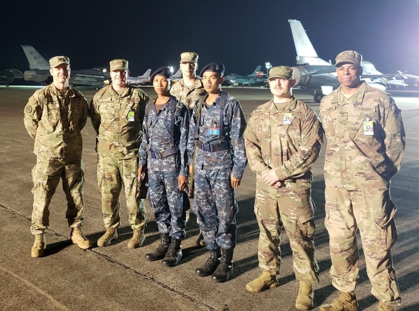 Group of Washington Air National Guardsmen with their Royal Thai Air Force counterparts stand guard at Korat Royal Thai Air Base, Thailand.