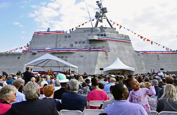 Audience members assemble for the commissioning ceremony of the Navy's newest littoral combat ship, USS Charleston (LCS 18).