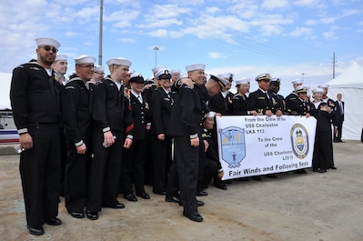 Sailors of the Navy's newest littoral combat ship, USS Charleston (LCS 18), hold a banner from the crew of the fifth ship to bear the name, USS Charleston (LKA 113). LCS 18 is the sixteenth littoral combat ship to enter the fleet and the ninth of the Independence variant.