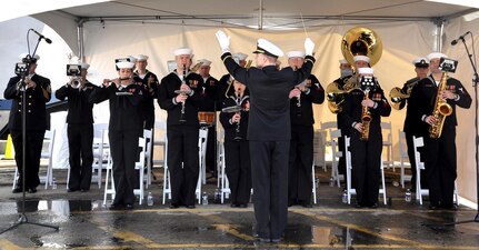 Members of the U.S. Fleet Forces Band and Joint Base Charleston Band play for the audience assembled for the commissioning ceremony of the Navy's newest littoral combat ship, USS Charleston (LCS 18).