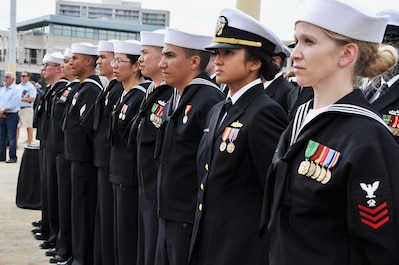 Sailors of the Navy's newest littoral combat ship, USS Charleston (LCS 18), stand at parade rest during the ship’s commissioning ceremony.