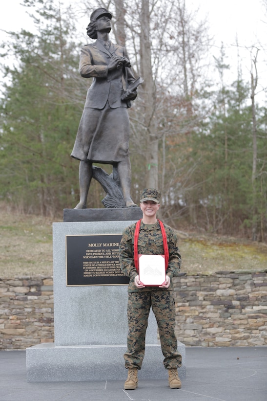 U.S. Marine Corps Cpl. Haley Mathers poses for a photo at the National Museum of the Marine Corps in Triangle, Virginia, following her promotion ceremony on March 8, 2019. The ceremony took place next to a replica of the Molly Marine statue, the first monument of a female in a service uniform and tribute to the first female Marines. Mathers was promoted on International Women's Day. This year marks 101 years of women serving in the U.S. Marines Corps. (U.S. Marine Corps photo by Cpl. Naomi May)