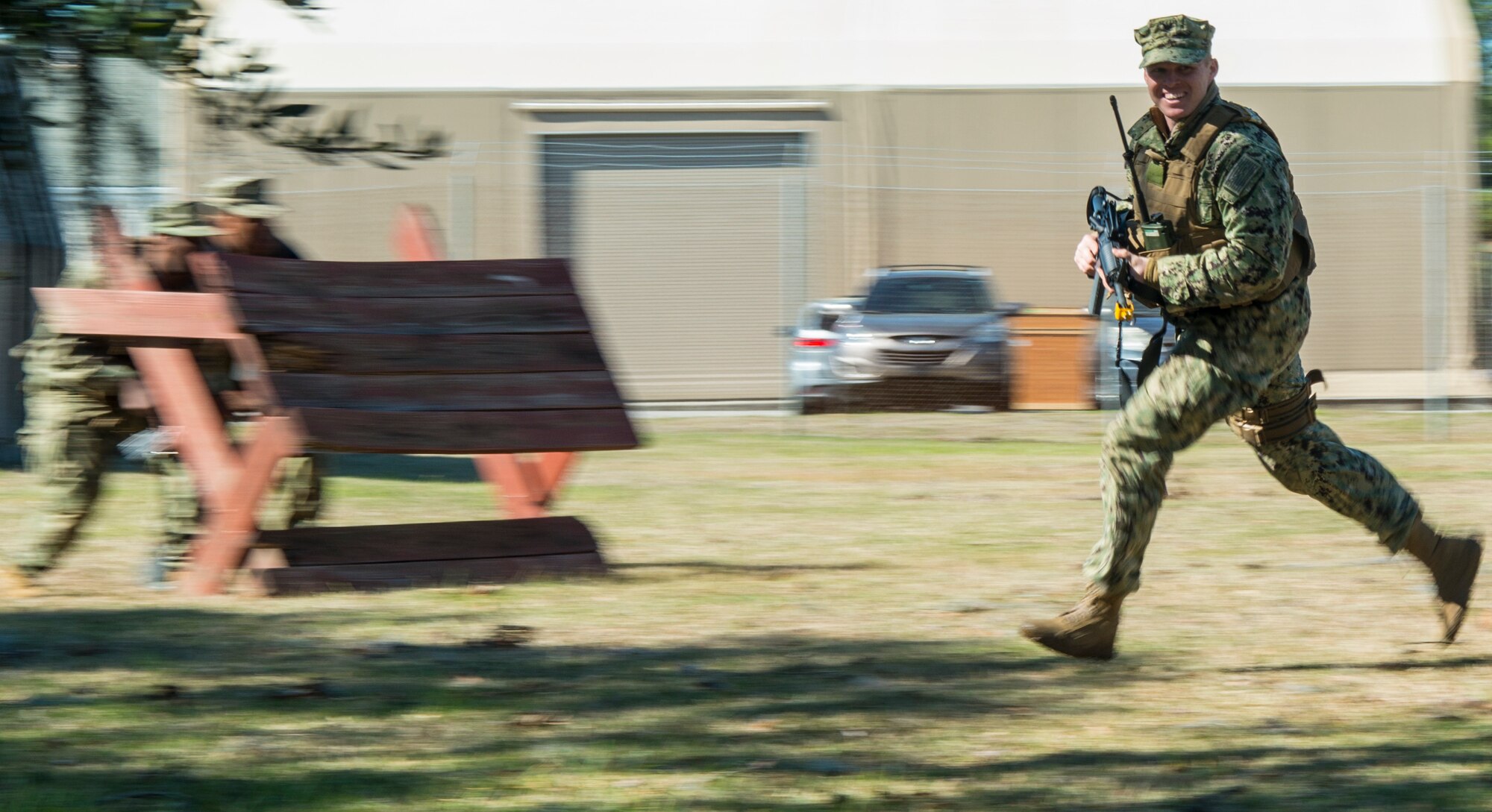 Master-at-Arms Petty Officer 3rd Class Adam Bolas, Coastal Riverine Squadron 10 Bravo 2nd Platoon, runs across the compound during one of the simulations for a deployment exercise March 6, 2019, at Joint Base Charleston, S.C. -- Naval Weapons Station.