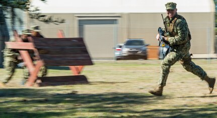 Master-at-Arms Petty Officer 3rd Class Adam Bolas, Coastal Riverine Squadron 10 Bravo 2nd Platoon, runs across the compound during one of the simulations for a deployment exercise March 6, 2019, at Joint Base Charleston, S.C. -- Naval Weapons Station.