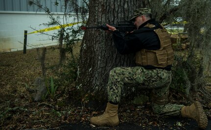 Master-at-Arms Petty Officer 3rd Class Samuel Dauphin, Coastal Riverine Squadron 10 Bravo 2nd Platoon, assumes a firing stance during a deployment exercise March 5, 2019, at Joint Base Charleston, S.C. -- Naval Weapons Station.