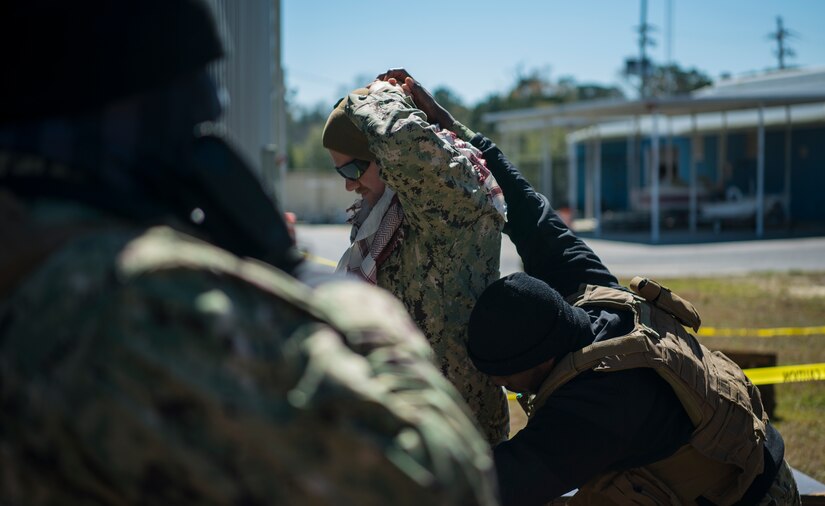 Boatswain’s Mate Petty Officer 3rd Class Karim Diallo, Coastal Riverine Squadron 10 Bravo 2nd Platoon, performs a personnel inspection during a deployment exercise March 6, 2019, at Joint Base Charleston, S.C. -- Naval Weapons Station.