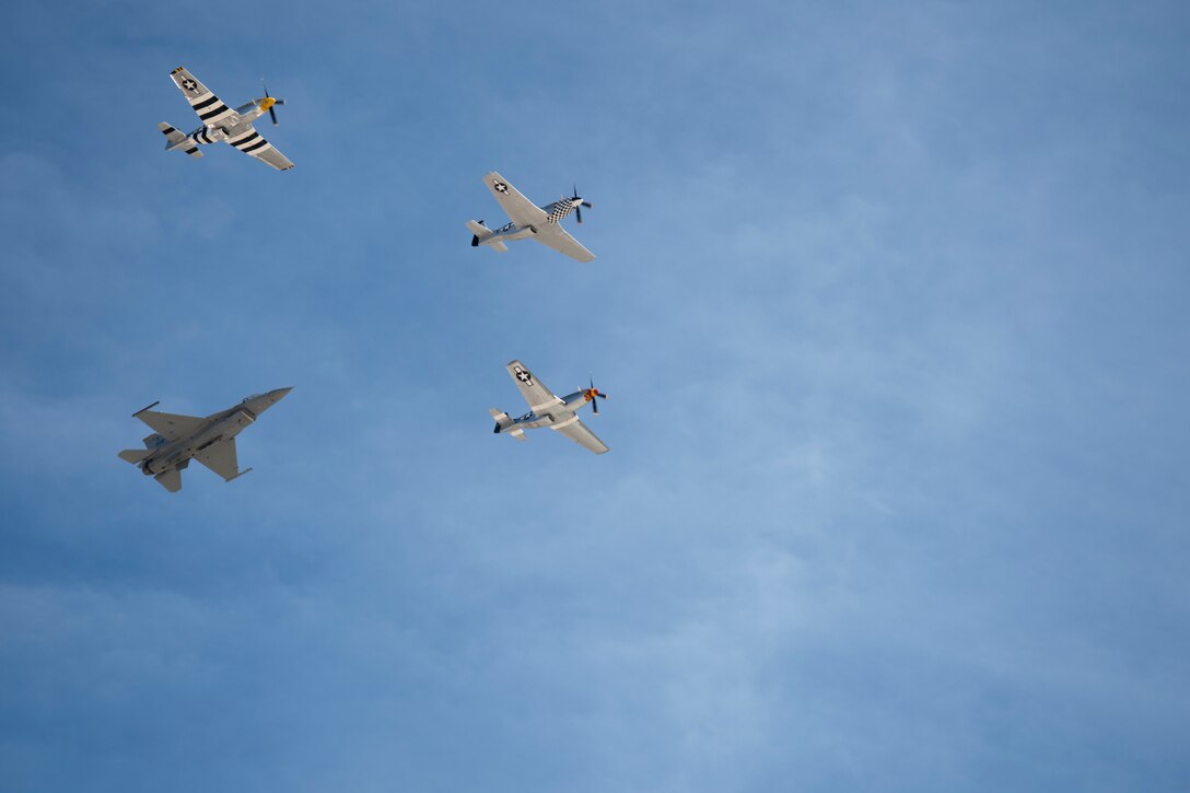 U.S. Air Force Maj. John Waters, F-16 Viper Demonstration Team pilot, bottom left, navigates his F-16 Fighting Falcon alongside Air Force Heritage Flight Foundation P-51 pilots during a heritage flight practice at Davis-Monthan Air Force Base, Ariz., March 3, 2019.