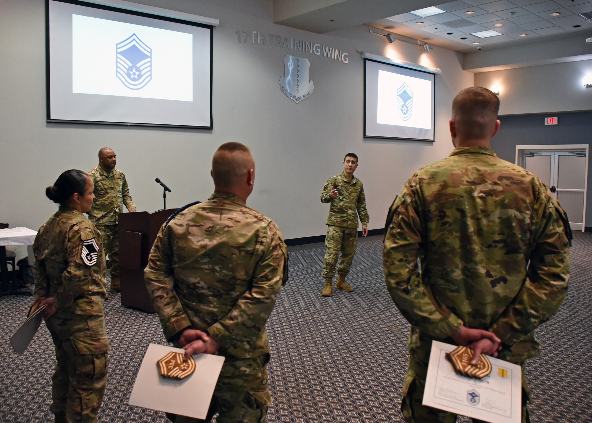 U.S. Air  Force Col Ricky Mills, 17th Training Wing commander, speaks to the three senior master sergeant selects on their role and what is expected of them from here on out during the senior master sergeant release celebration at the Event Center on Goodfellow Air Force Base, Texas, March 7, 2019. Senior master sergeants continue to develop their leadership and management skill in preparation for expanded responsibilities and higher leadership positions. (U.S. Air Force photo by Airman 1st Class Zachary Chapman/Released)