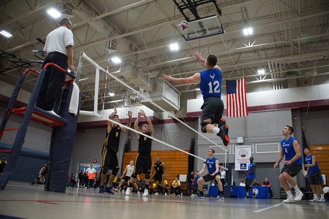 Elite U.S. military volleyball players from around the world compete for dominance at Fort Bragg's Ritz Epps Physical Fitness Center March 6-8, 2019 to determine the best of the best at the 2019 Armed Forces Volleyball Championship. Army, Navy (with Coast Guard) and Air Force teams squared off at the annual AFVC through three days of round-robin competition, to eventually crown the best men and women volleyball players in the military. U.S. Navy photo by Mass Communications Specialist 1st Class John Benson (Released)