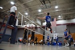 FORT BRAGG, N.C. –  Airman 1st Class Tyson Wilcock of Travel AFB, Calif. gets air as he pushes the ball over Army's block. Elite U.S. military volleyball players from around the world compete for dominance at Fort Bragg's Ritz Epps Physical Fitness Center March 6-8, 2019 to determine the best of the best at the 2019 Armed Forces Volleyball Championship. Army, Navy (with Coast Guard) and Air Force teams squared off at the annual AFVC through three days of round-robin competition, to eventually crown the best men and women volleyball players in the military. U.S. Navy photo by Mass Communications Specialist 1st Class John Benson (Released)