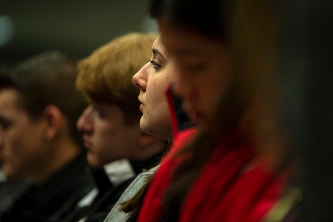 A young woman’s face, among many.