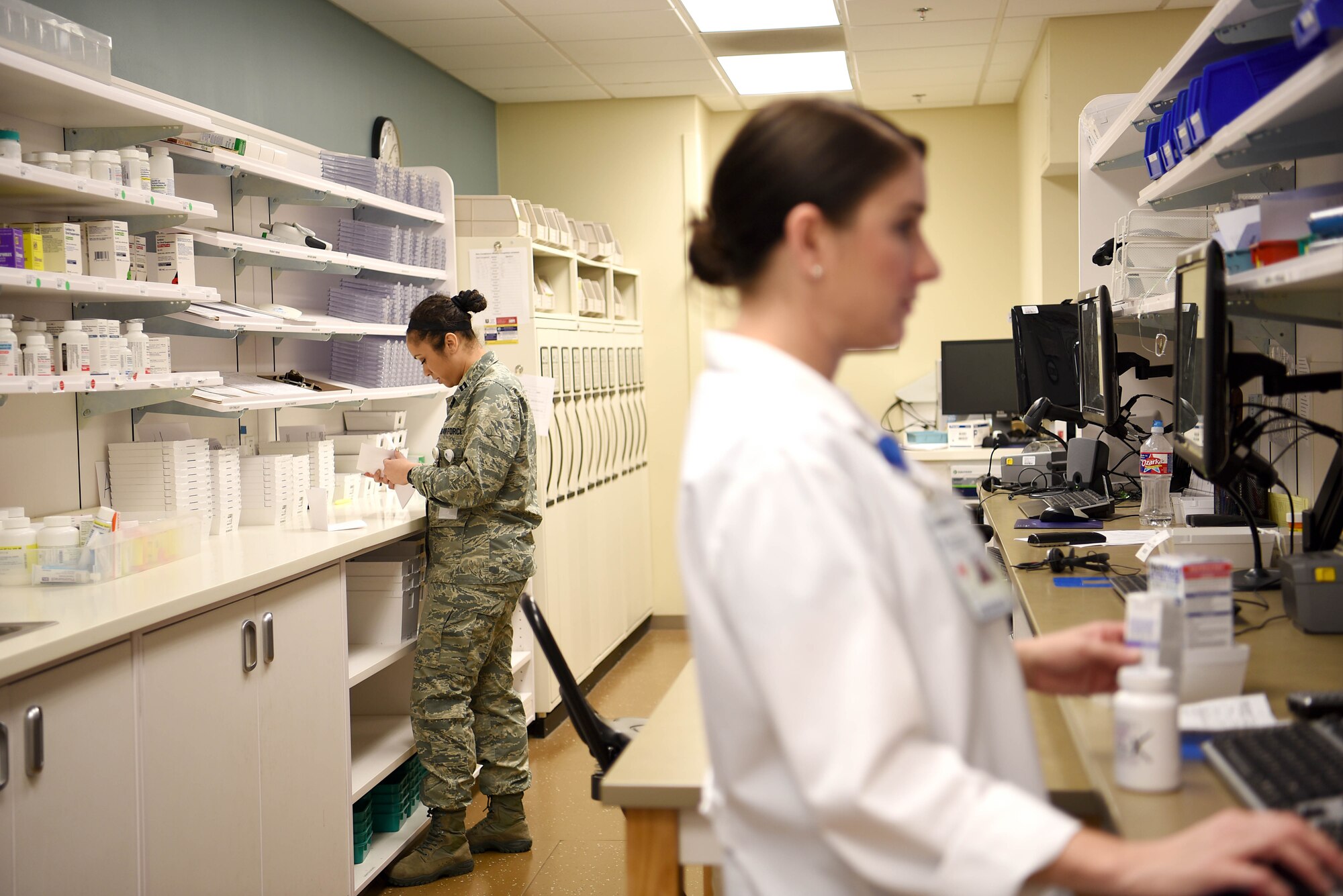 U.S. Air Force Capt. Whitney Howard, 14th Medical Support Squadron pharmacist, works on refilling prescriptions at Columbus Air Force Base, Mississippi, March 4, 2019. Pharmacists work with technicians to approve prescriptions and ensure customers are receiving the right care. (U.S. Air Force photo by Airman 1st Class Keith Holcomb)
