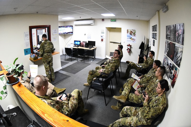 Service members wait to be assisted in the 380th Air Expeditionary Wing Financial Management office at Al Dhafra Air Base, United Arab Emirates, Mar. 7, 2019. FM provides customer service and financial analysis for various organizations and vendors. (U.S. Air Force photo by Senior Airman Mya M. Crosby)