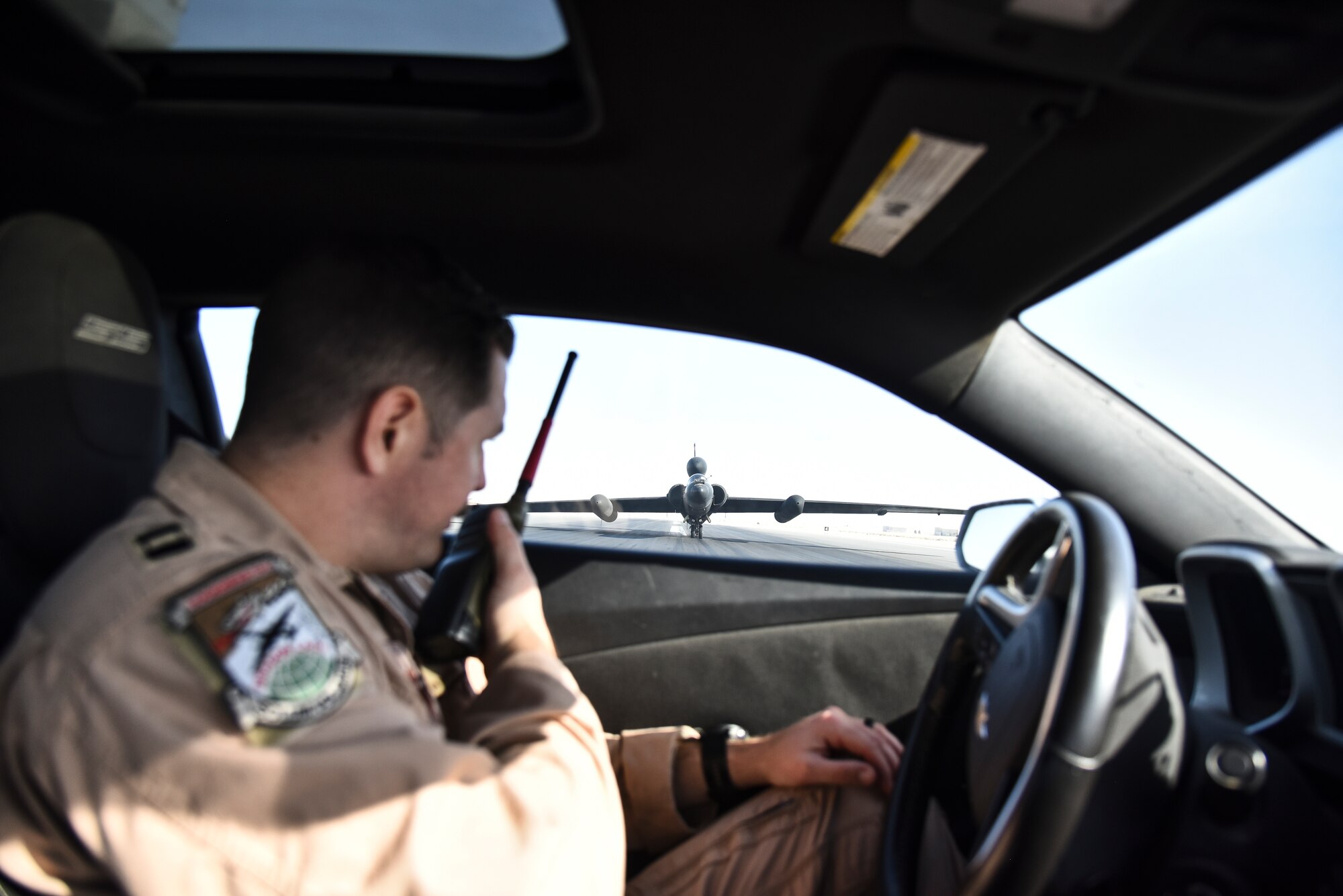 Capt. Ian McDougall, 99th Expeditionary Reconnaissance Squadron U-2 Dragon Lady pilot, watches as a U-2 successfully lands at Al Dhafra Air Base, United Arab Emirates, Mar. 5, 2019. The U-2 is a high-altitude reconnaissance and surveillance aircraft providing signals and imagery intelligence and has the ability to detect radar, acoustic, nuclear, chemical and biological signatures. (U.S. Air Force photo by Senior Airman Mya M. Crosby)