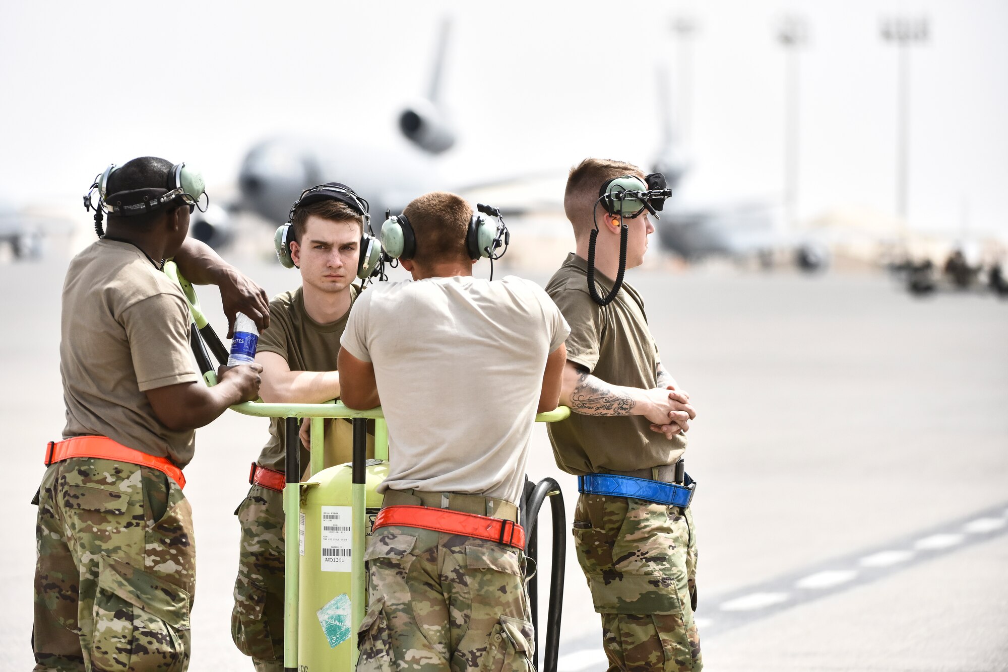 Airmen assigned to the 380th Expeditionary Maintenance Group rest on the flight line at Al Dhafra Air Base, United Arab Emirates, Mar. 5, 2019. The 380th EMXG is in charge of maintaining the combat-ready aircraft at ADAB to maintain the mission. (U.S. Air Force photo by Senior Airman Mya M. Crosby)