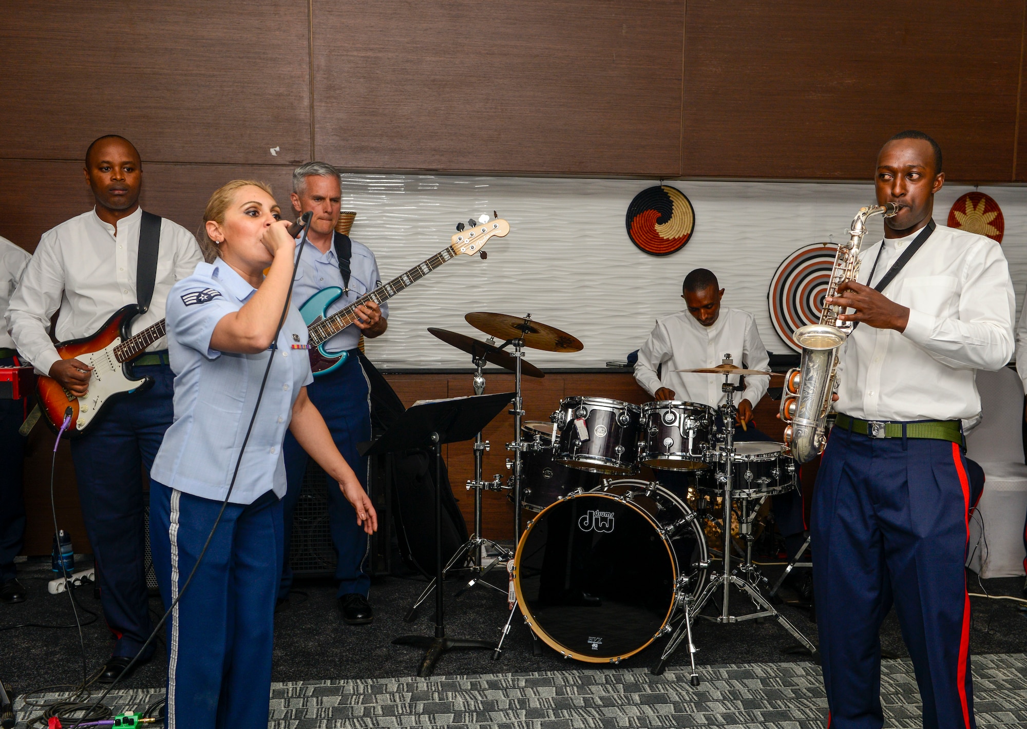 U.S. Airmen assigned to the U.S. Air Forces in Europe Band perform alongside member of the Rwanda Defence Force Band during an African Partnership Flight Rwanda cultural dinner in Kigali, Rwanda, March 7, 2019. The bands used music to enhance the people-to-people relationship between the United States, Rwanda, and the other participating countries in the APF Rwanda. (U.S. Air Force photo by Tech. Sgt. Timothy Moore)