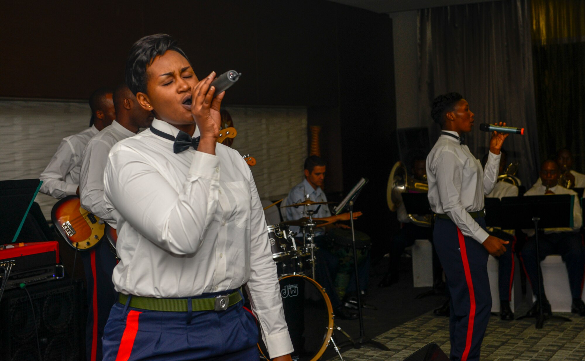 Members of the Rwanda Defence Force Band perform alongside U.S. Airmen assigned to the U.S. Air Forces in Europe Band during an African Partnership Flight Rwanda cultural dinner in Kigali, Rwanda, March 7, 2019. The bands used music to enhance the people-to-people relationship between the United States, Rwanda, and the other participating countries in the APF Rwanda. (U.S. Air Force photo by Tech. Sgt. Timothy Moore)