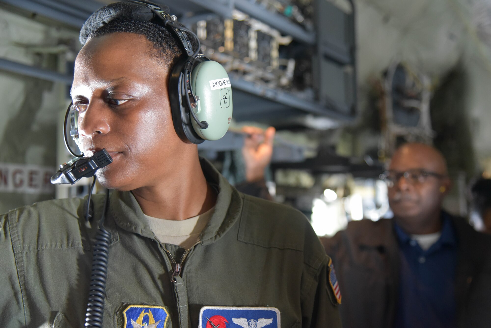 Tech. Sgt. Karen Moore, 53rd Weather Reconnaissance Squadron, demonstrates her job duties to Keesler Air Force Base, Miss., Honorary Commanders during a training flight on a WC-130J Hercules March. 8, 2019.The 403rd Wing, an Air Force Reserve Command unit, hosted the group for a tour of the wing highlighting several of the unit’s missions to include the 815th Airlift Squadron, 36th Aermedical Evacuation, and a flight with the Air Force Reserve Hurricane Hunters. (U.S. Air Force photo by Tech. Sgt. Michael Farrar)