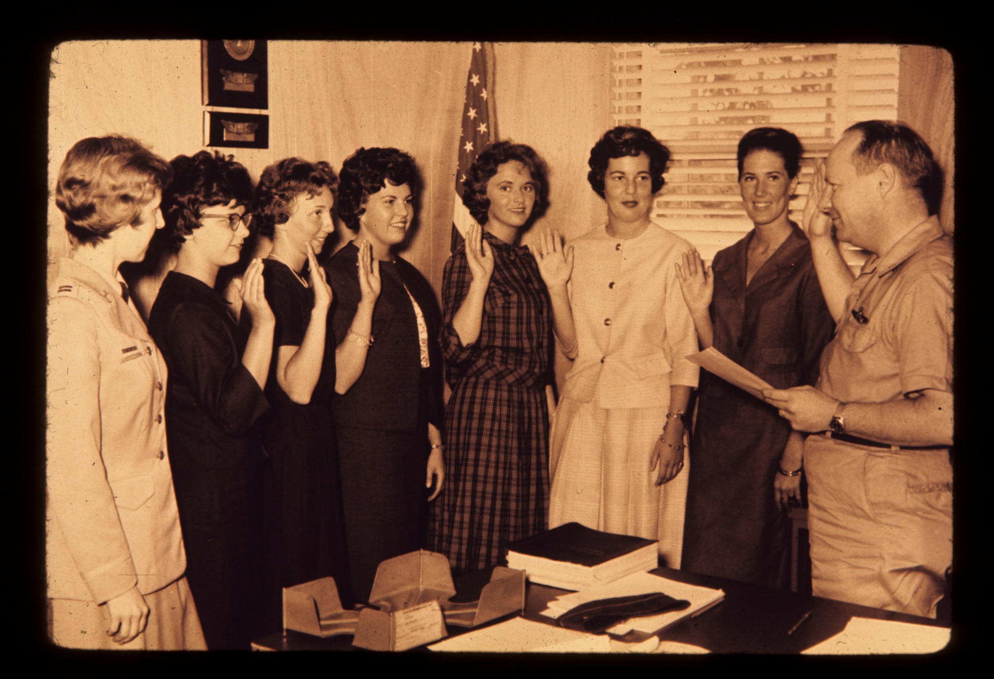 In with the new - Col. Daniel Schmehl gives the oath of enlistment to six new nurses of Olmstead Air Force Base, Middletown, Pa., in 1964. On the far left Constance Aungst, one of the first nurses of the Wing, watches as Judith Seitz, Judith Smith, Nancy Lagyak, Anna Fedora, Mary Pollack, and Constance Riley swear in as the newest members of the Medical Squadron.