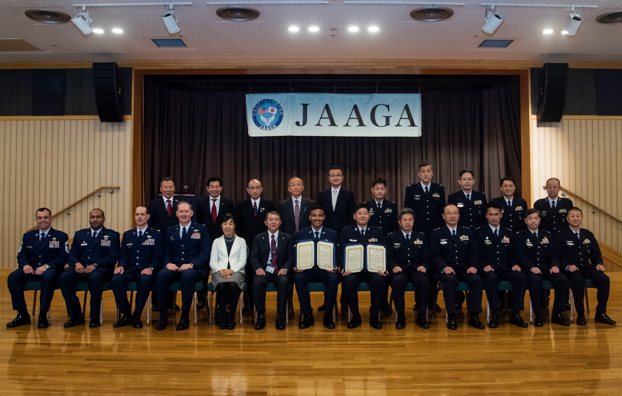 U.S. Air Force 35th Fighter Wing Airmen and the Japan-America Air Force Goodwill Association leaders pose for a group photo after a JAAGA award ceremony at Misawa Air Base, Japan, March 6, 2019. Misawa City established the association 21 years ago and ever since, Misawa AB and the JAAGA members held award ceremonies to honor the selected U.S. Air Force and Japan Air Self-Defense Force enlisted service members, who strive to build the U.S. and Japan partnership. (U.S. Air Force photo by Senior Airman Sadie Colbert)