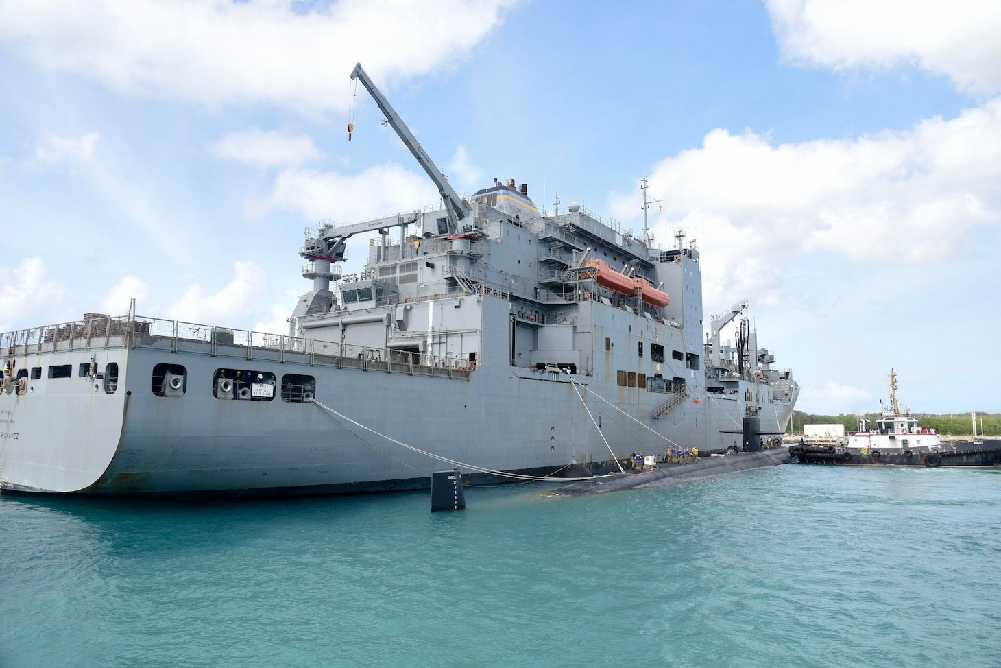 APRA HARBOR, Guam (March 11, 2019) – USS Oklahoma City (SSN 723), a Los Angeles-class submarine, prepares to moor next to USNS Cesar Chavez (T-AKE 14) during an exercise in Apra Harbor, March 11. The exercise aims to assess the capabilities of USNS vessels to service submarines while in port and underway.