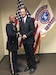 Newly commissioned Lt. Col. Stephen Bayles, M.D., F.A.C.S, is congratulated by Maj. Richard Smith, Seattle Medical Recruiting Station officer-in-charge