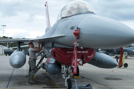 Staff Sgt. Jonathan Gill, a crew chief with the 187th Maintenance Group, inspects an F-16 fighting falcon aircraft Feb. 3, 2019 at Dannelly Field, Ala. Gill was recently selected to become an F-16 fighter pilot with the wing's 100th Fighter Squadron Red Tails.