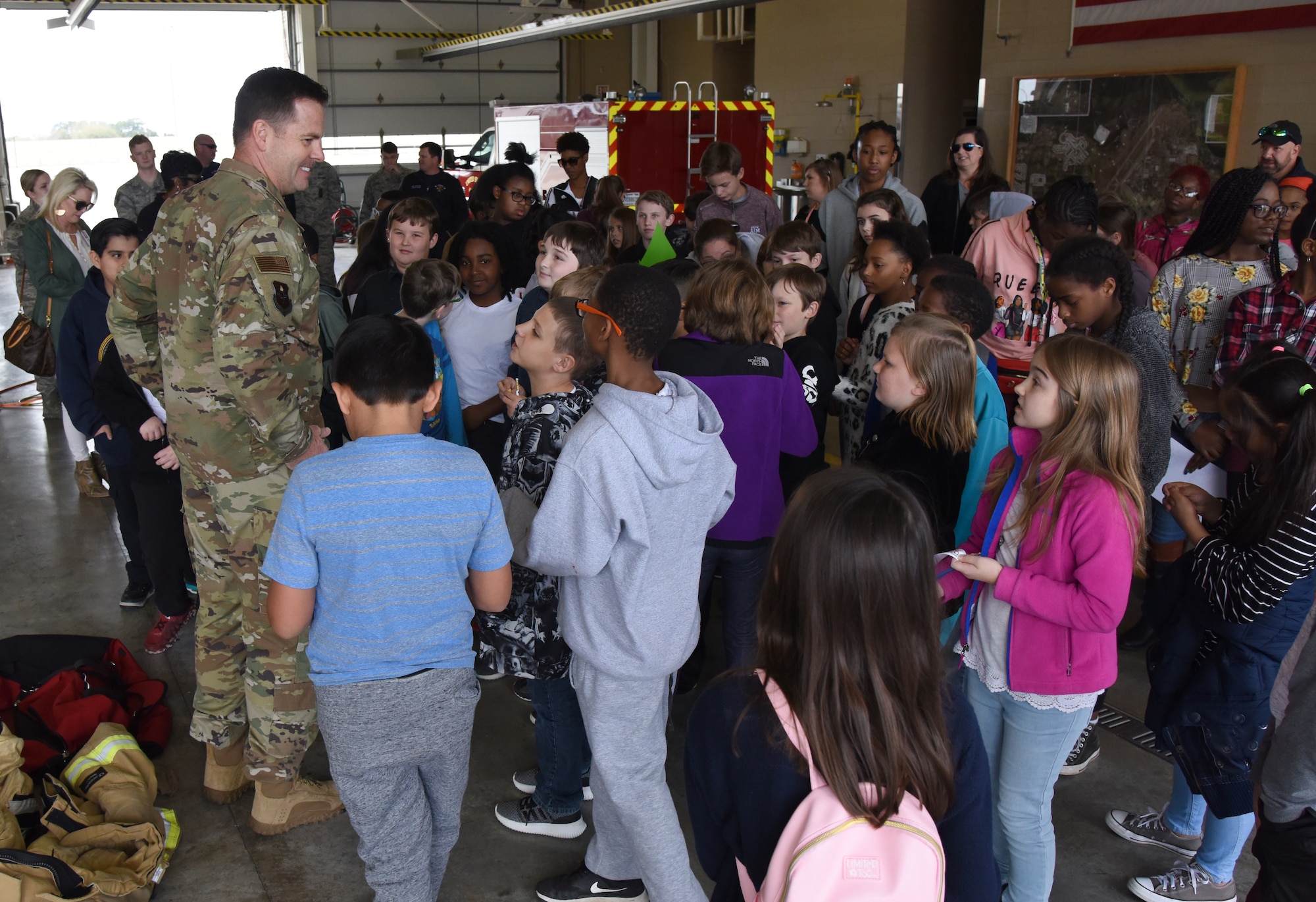 U.S. Air Force Col. Lance Burnett, 81st Training Wing vice commander, delivers closing remarks to school-aged children during Biloxi School District Career Exploration Day on Keesler Air Force Base, Mississippi, March 7, 2019. Throughout their visit, the children toured the 334th Training Squadron air traffic control school, 335th TRS weather facility, the Keesler Fire Department and received a demonstration from the 81st Security Forces Squadron military working dogs. (U.S. Air Force photo by Kemberly Groue)