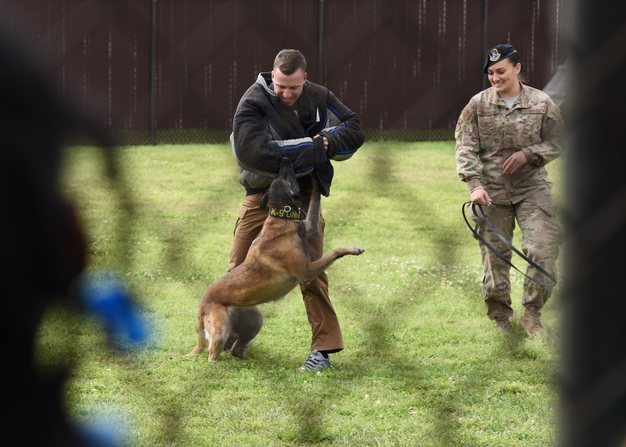 U.S. Air Force Senior Airman Matthew Brooks, 81st Security Forces Squadron military working dog handler, (left), Senior Airman Tilar Robinson, 81st SFS military working dog handler, and Mmaura, 81st SFS military working dog, provides a demonstration for school-aged children during Biloxi School District Career Exploration Day on Keesler Air Force Base, Mississippi, March 7, 2019. The children also toured the 334th Training Squadron air traffic control school, 335th TRS weather facility and the Keesler Fire Department. (U.S. Air Force photo by Kemberly Groue)