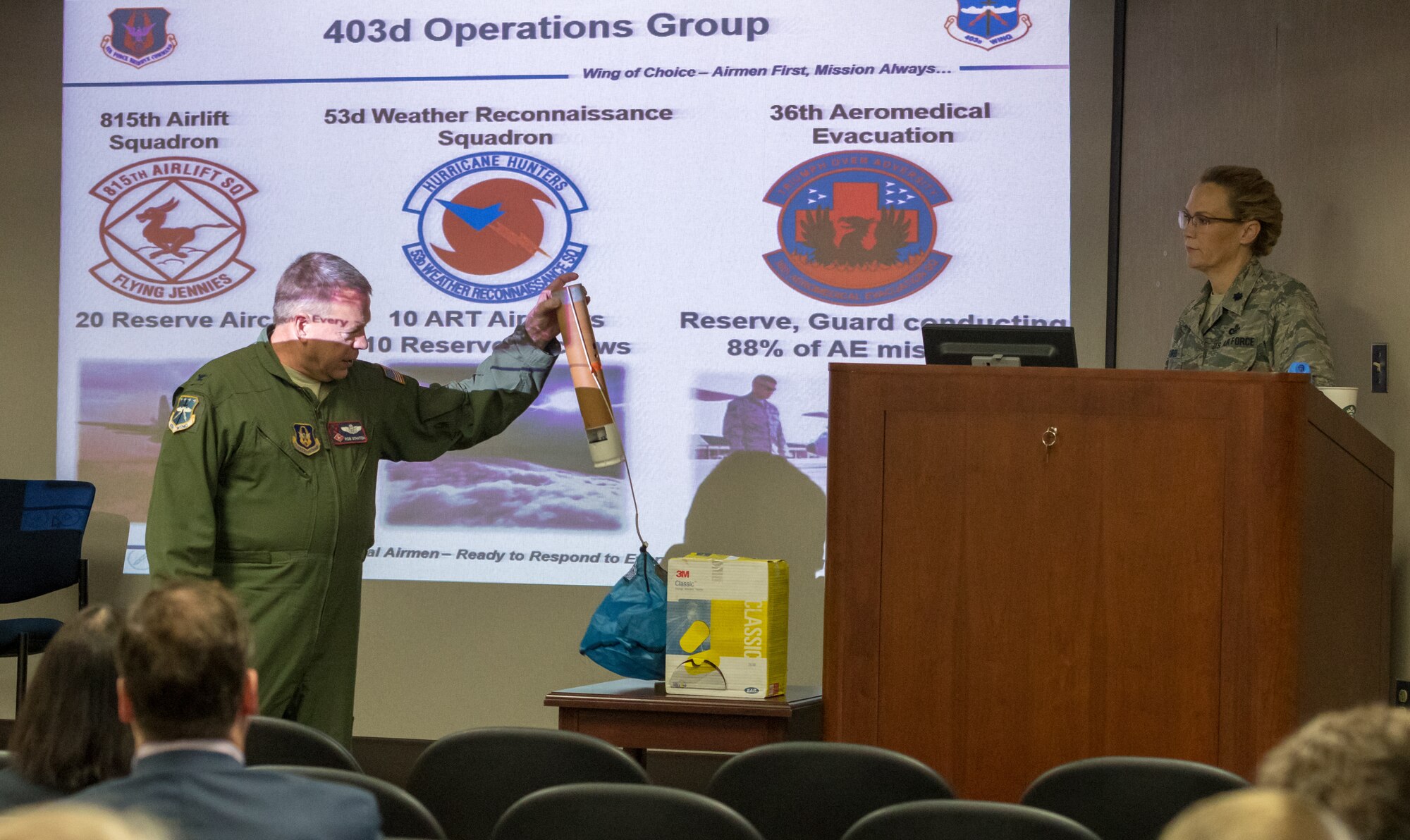 U.S. Air Force Col. Robert Stanton, 403rd Wing vice commander, holds a dropsonde during a mission brief for Keesler honorary commanders during the 403rd Wing Honorary Commanders Tour at the 53rd Weather Reconnaissance Squadron at Keesler Air Force Base, Mississippi, March 08, 2019. The tour was intended to familiarize honorary commanders with the 403rd Wing and the Air Force Reserve mission and capabilities. The event also included an incentive flight on a WC-130J Hercules. (U.S. Air Force Photo by Andre' Askew)