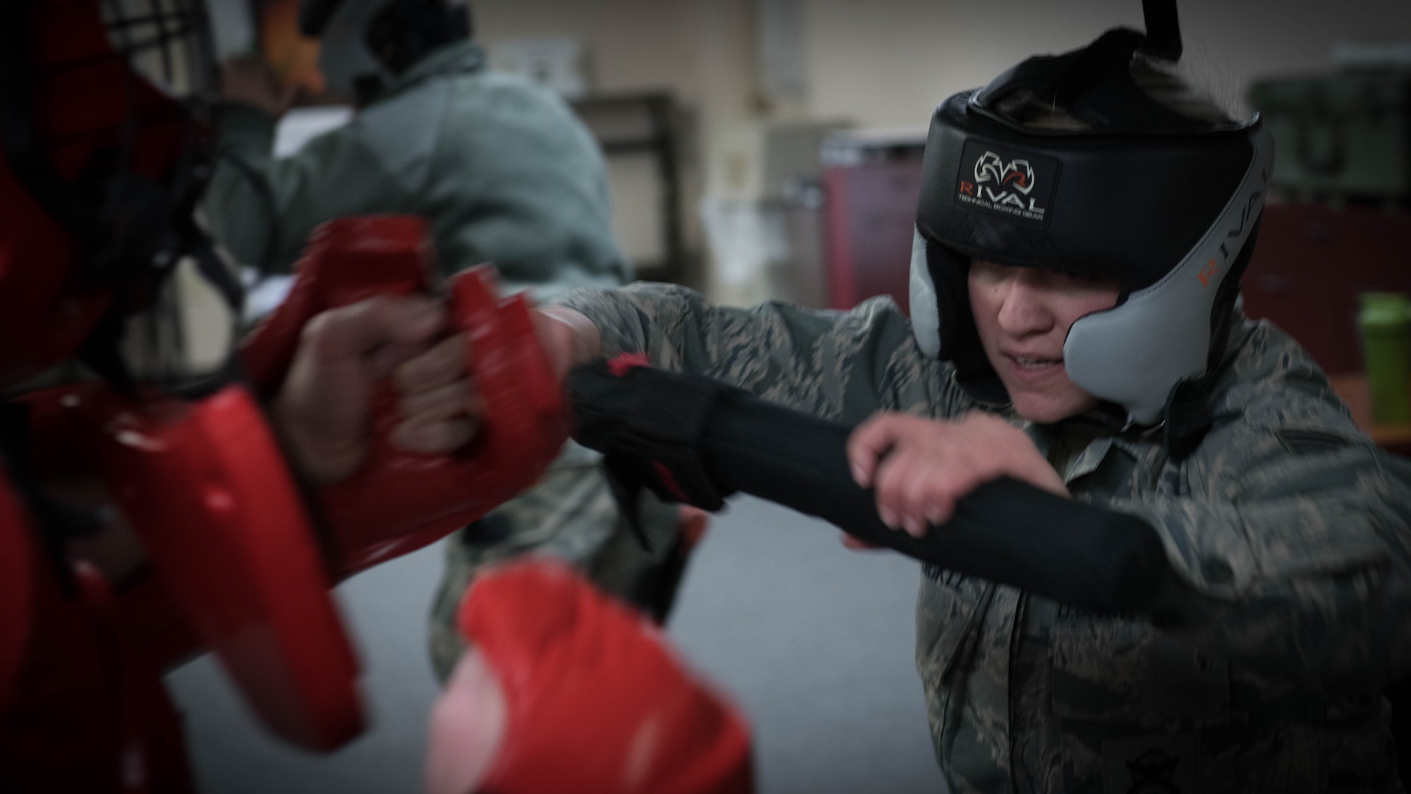 Senior Airman Ashley Van Sickle, a fireteam member with the 910th Security Forces Squadron, spars with Master Sgt. Michael Skraba, the training program manager for the 910th SFS, during a “Red-Man” examination as part of a police baton training course.