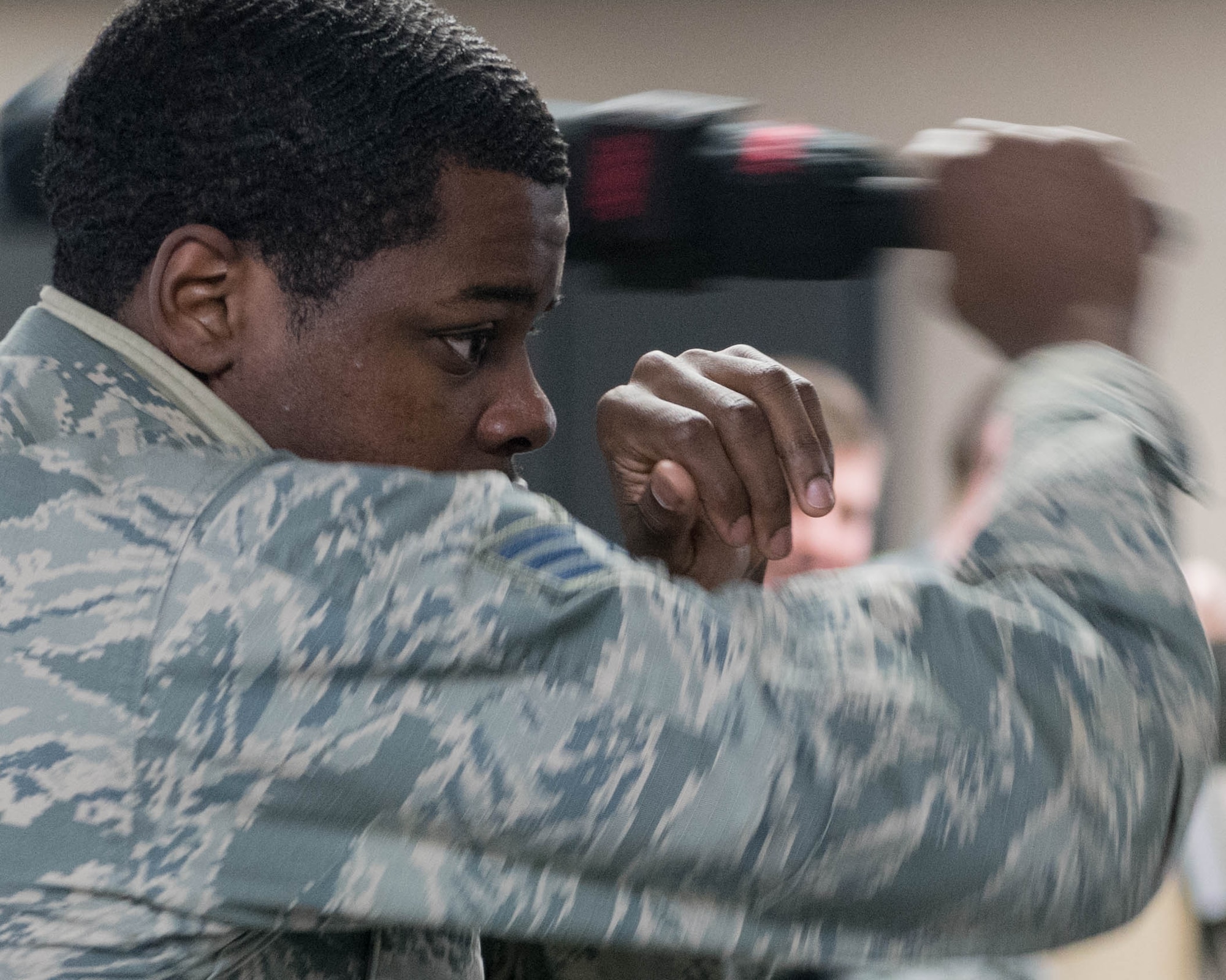 Senior Airman Eusevius Howard, a fireteam member from the 910th Security Forces Squadron, practices a forward strike on a sparring pad during a police baton training course March 10, 2018, in the old Combat Arms Training building here.