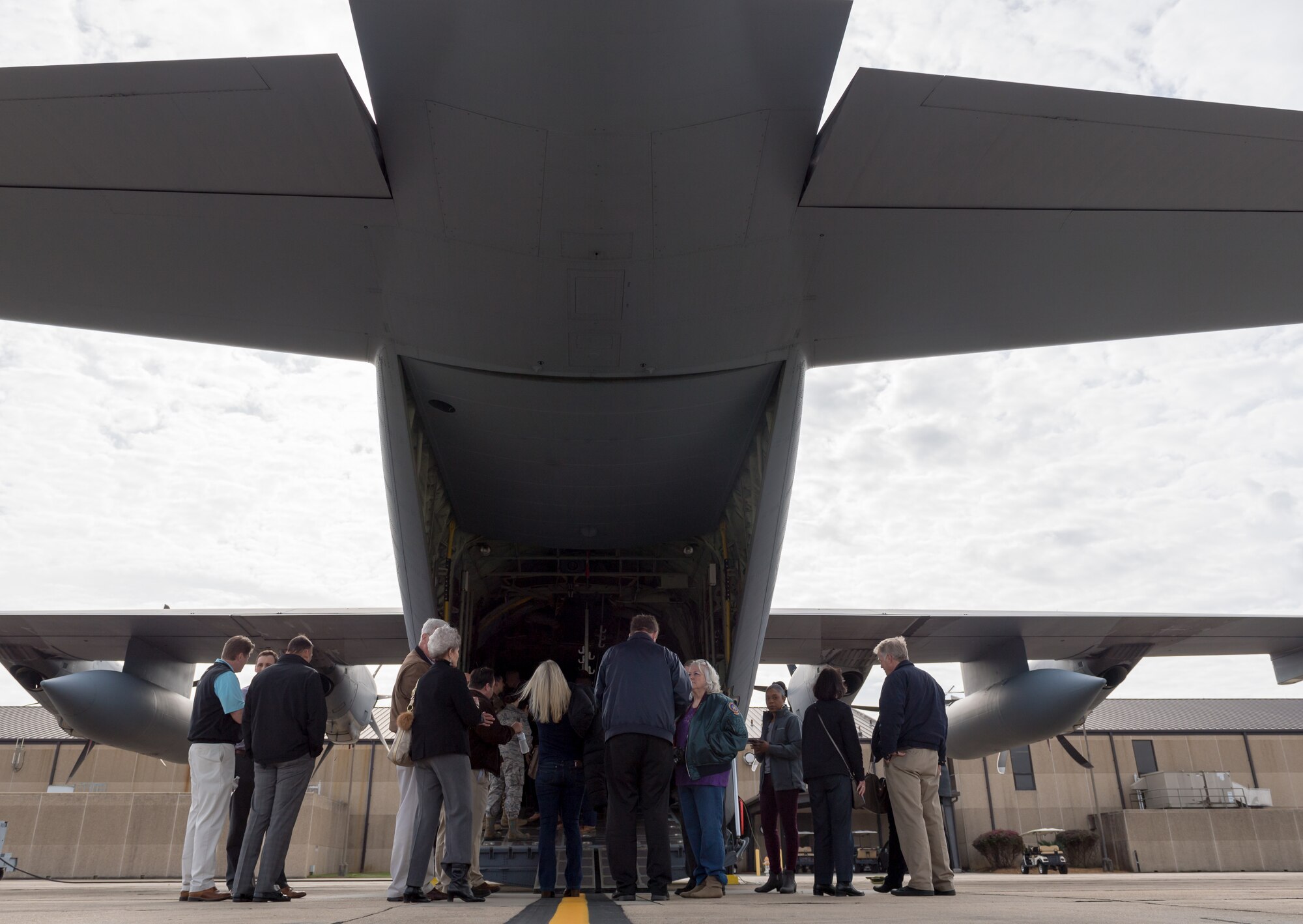 Keesler honorary commanders gather at the rear of a WC-130J Hercules during the 403rd Wing Honorary Commanders Tour at Keesler Air Force Base, Mississippi, March 08, 2019. The tour was intended to familiarize honorary commanders with the 403rd Wing and the Air Force Reserve mission and capabilities. The event also included an incentive flight on a WC-130J Hercules. (U.S. Air Force Photo by Andre' Askew)