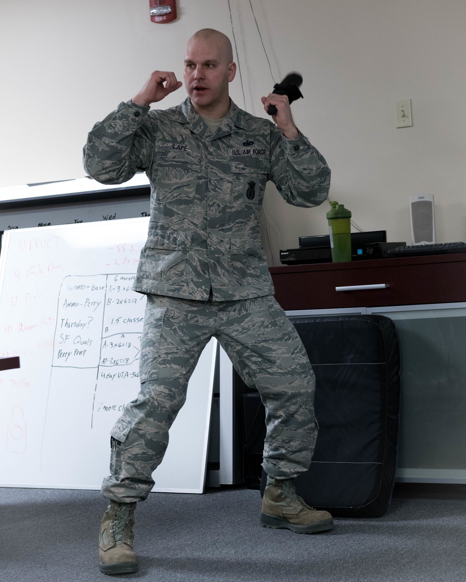 Tech. Sgt. Richard Lape, a fireteam leader with the 910th Security Forces Squadron, instructs a class of more than 20 Reserve Citizen Airmen from the 910th SFS during refresher training on use of force, March 10, 2018, in the old Combat Arms Training and Maintenance building here.