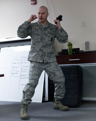 Tech. Sgt. Richard Lape, a fireteam leader with the 910th Security Forces Squadron, instructs a class of more than 20 Reserve Citizen Airmen from the 910th SFS during refresher training on use of force, March 10, 2018, in the old Combat Arms Training and Maintenance building here.